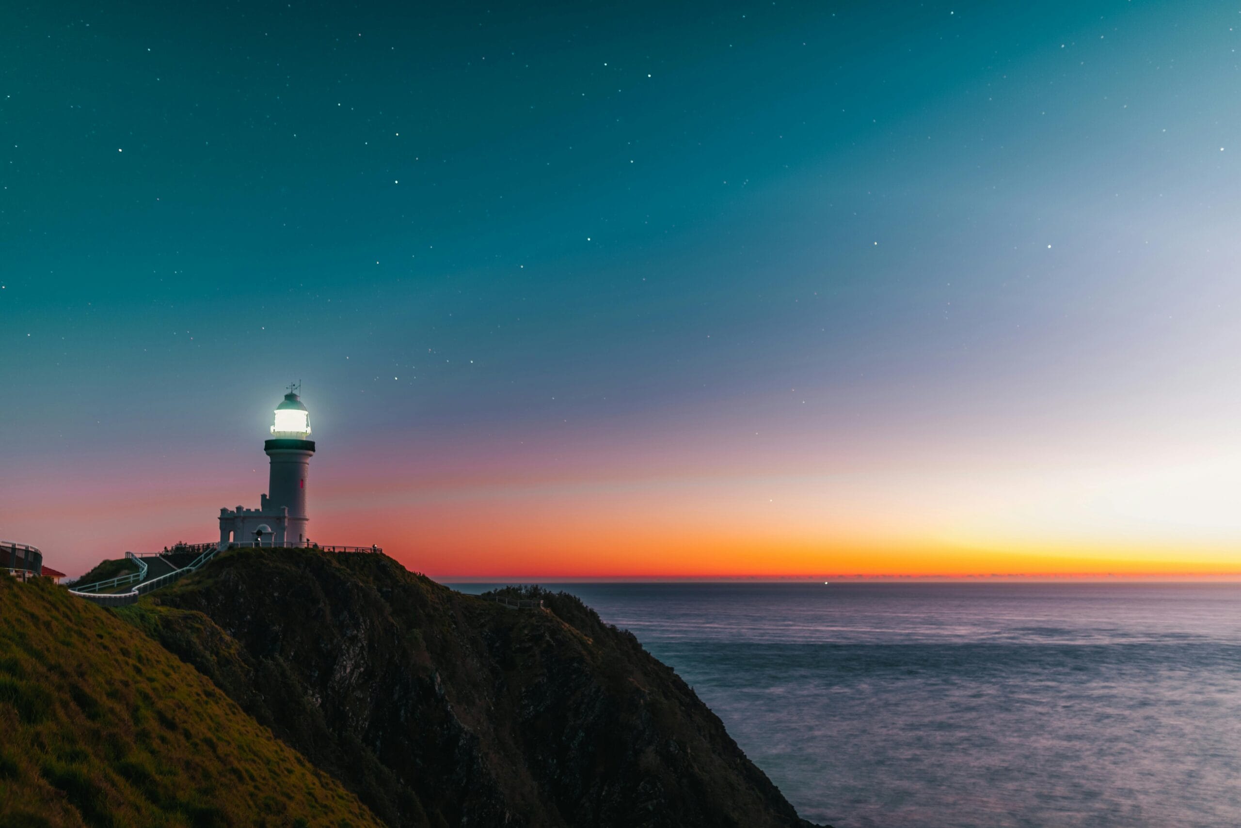 Lighthouse symbolizing leadership role in providing guidance and direction during stormy weather.